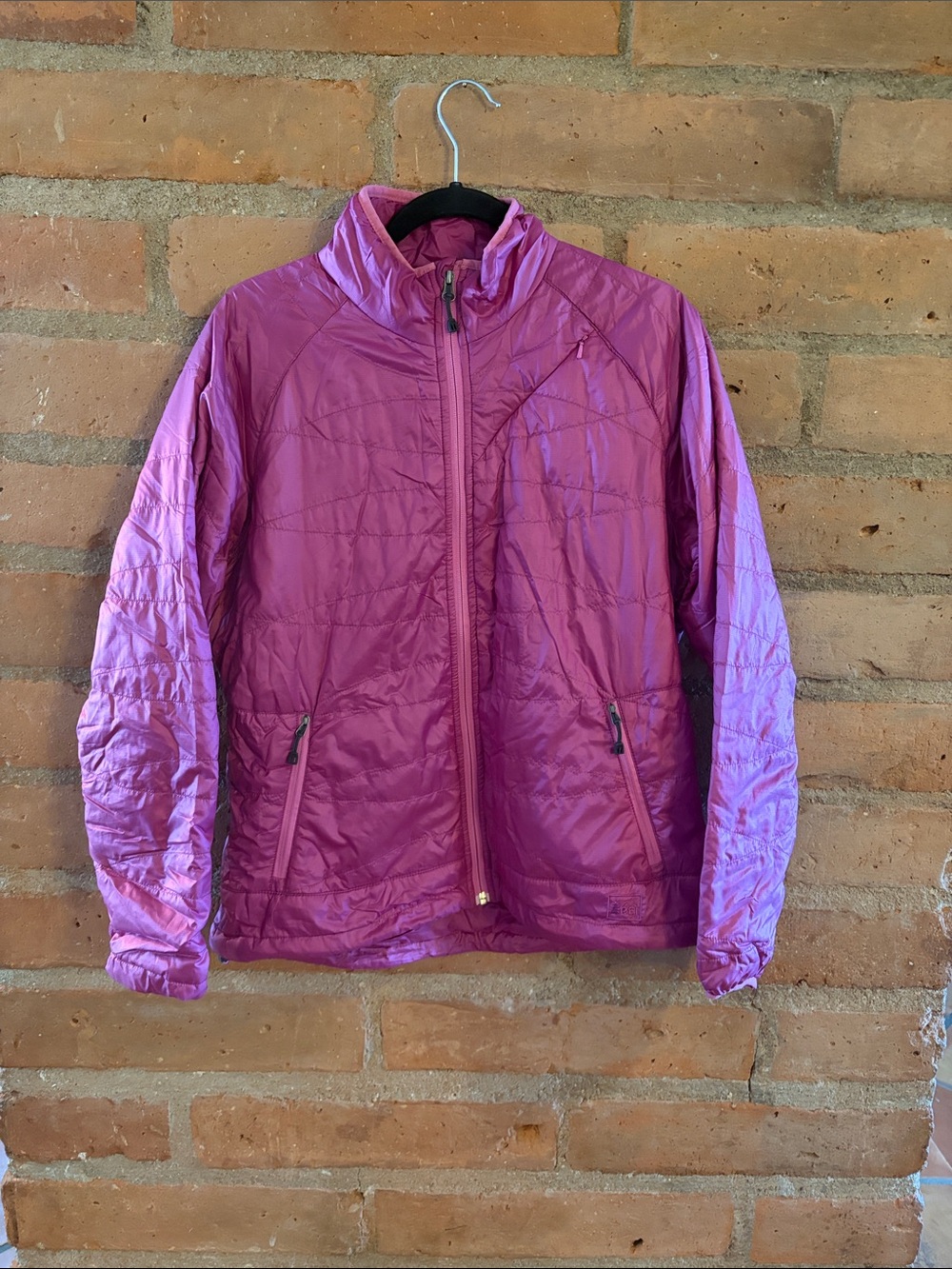 REI women’s Lightweight Magenta Puffer Jacket with travel bag